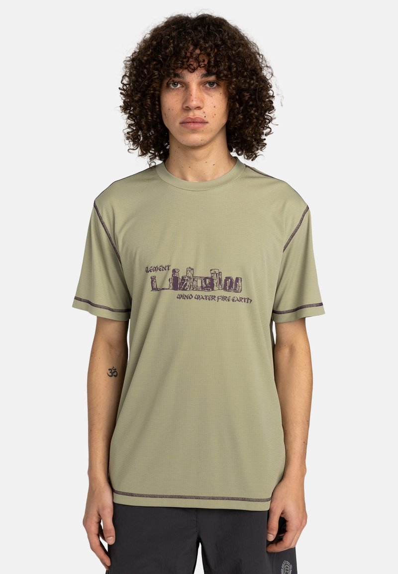 Light green short-sleeve t-shirt with a textured surface. Features purple graphic print and contrasting stitching along the edges.