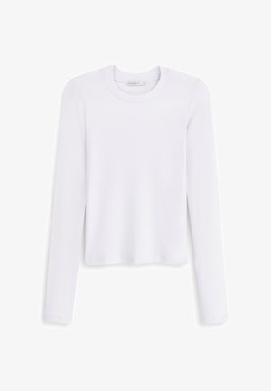 Biała, długosleeve'owa bluzka z ribbowanej tkaniny, z okrągłym dekoltem i bocznymi rozcięciami, wykonana z miękkiego materiału. Prosty design bez wzorów i akcentów.