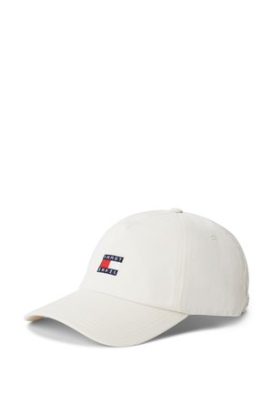Cappellino da baseball color avorio con visiera curva, caratterizzato da una piccola toppa con il logo Tommy Jeans in rosso, bianco e blu al centro frontale.