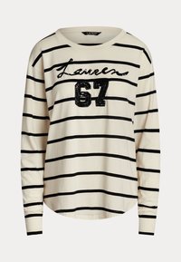 Långärmad tröja med rundad hals i krämfärgad med svarta horisontella ränder. Har en paljettsmrytad "Lauren 67" på framsidan. Material i bomull.