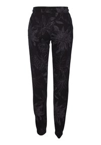 Svarta joggers med ett blommönster i mörkgrått, med elastisk midja och smal passform, tillverkade av mjukt och elastiskt tyg.