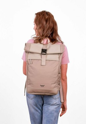 Beige roll-top backpack made of durable material with a black buckle closure, adjustable straps, and a small logo at the base.