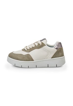White sneaker with green suede accents and metallic heel. Features flat laces, rounded toe, and a thick white rubber sole with grooves.