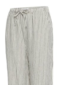 Pantalones beige claro con cordón, rayas verticales negras finas y bolsillos laterales, con cintura elástica.