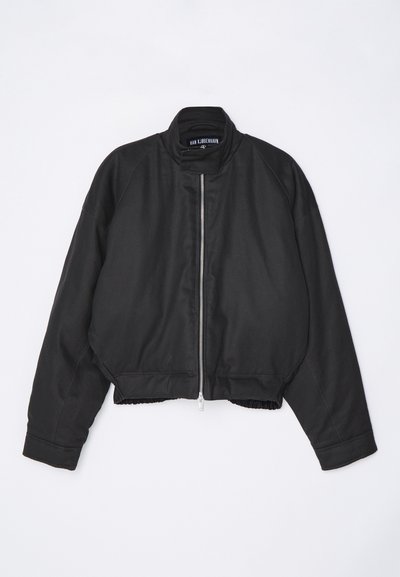 Black bomber jacket with a high collar, zip front closure, and gathered hem. Features raglan sleeves and a smooth fabric texture.
