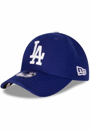 Blue baseball cap with white embroidered "LA" logo on the front, curved visor, and a tag on the side; made from textured fabric.