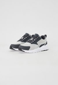 Sport sneakers in gray and black with mesh and synthetic upper, lace-up design, padded collar, and a white speckled sole.