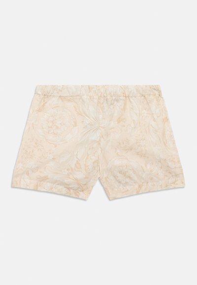 Μπεζ σορτς με μοτίβο λουλουδιών, ελαστική μέση και απαλό ύφασμα, σχεδιασμένα για άνεση και καθημερινή χρήση.