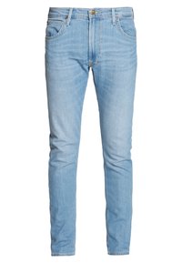 Ljusblå jeans med smal passform, tillverkade av denim, med standardfickor, kontrasterande sömmar och klassisk knappgylf.