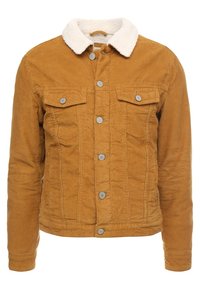 Manžestrová bunda v hořčicové barvě, s měkkým bílým kožíškovým límcem, zapínáním na knoflíky a dvěma náprsními kapsami. Strukturální látka s žebrovaným vzorem.