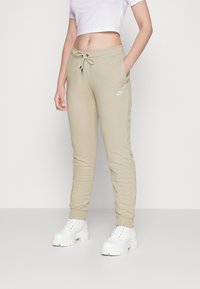 Nike Sportswear Calças de fato de treino - rattan/white