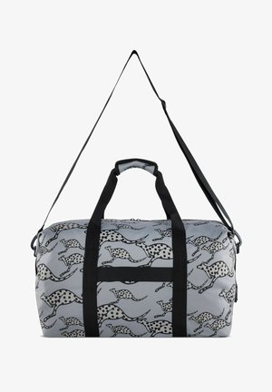 Duffle bag in light grey with a repeated black and white animal print design. Features two black handles and an adjustable shoulder strap.