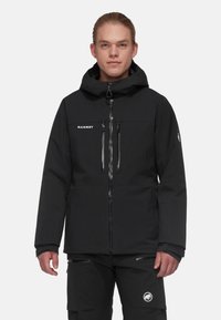 Black waterproof jacket with a hood, two zippered front pockets and logo detail. Features a clean, minimalist design and textured fabric.