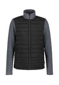 Chaleco acolchado negro con mangas de punto gris. Presenta un cuello alto y cierre frontal. Los bolsillos laterales están integrados en el diseño.