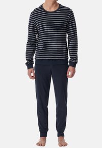 Navy striped long-sleeve top with white horizontal stripes, crew neck, and ribbed cuffs; paired with matching navy drawstring sweatpants.