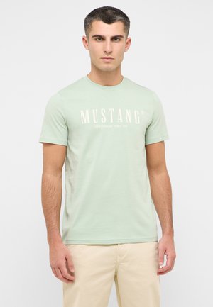 T-shirt con stampa - grün