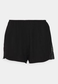 Schwarze Shorts aus weichem Stoff mit lockerer Passform und Spitzenverzierung am seitlichen Saum. Glatte Textur, elastischer Bund.