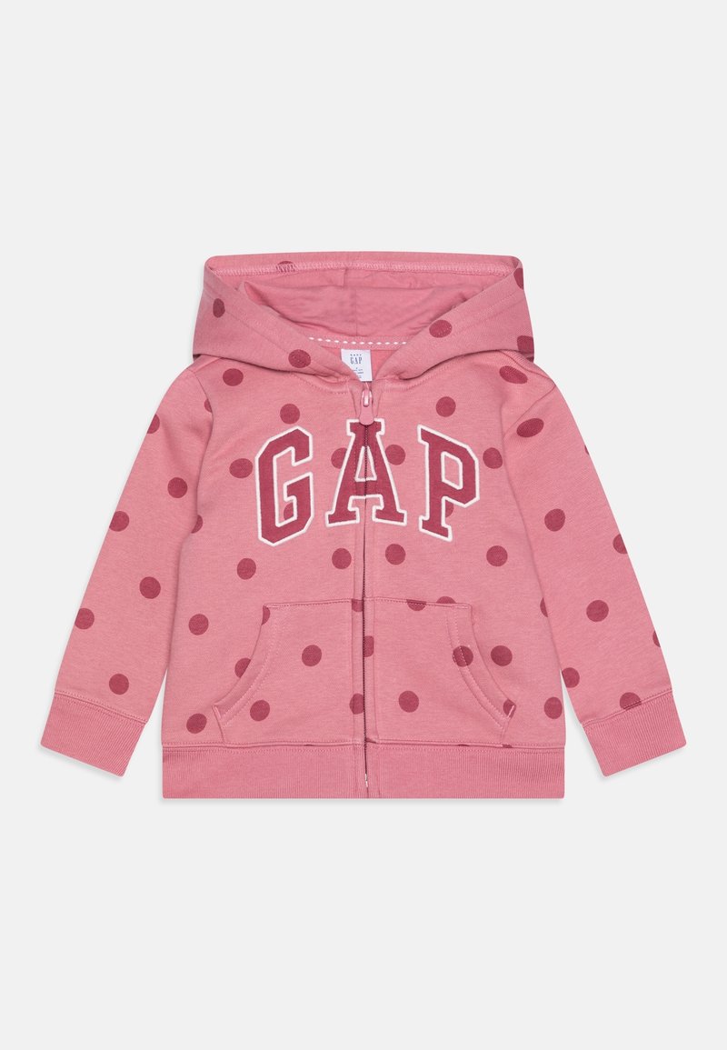 Sweat à capuche zippé rose pour enfants avec des pois rose foncé, poches avant, une capuche et lettrage du logo GAP sur la poitrine.