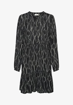 Mustaga pikkade varrukatega kleit, ümmargune kaelus, nööbiväli ja voogav seelik. Kangas on kaunistatud valge abstraktse mustriga.