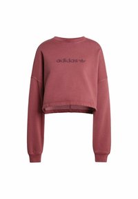 Felpa corta in rosa polveroso, realizzata in cotone. Presenta maniche lunghe, collo a costine e logo Adidas ricamato nello stesso colore.