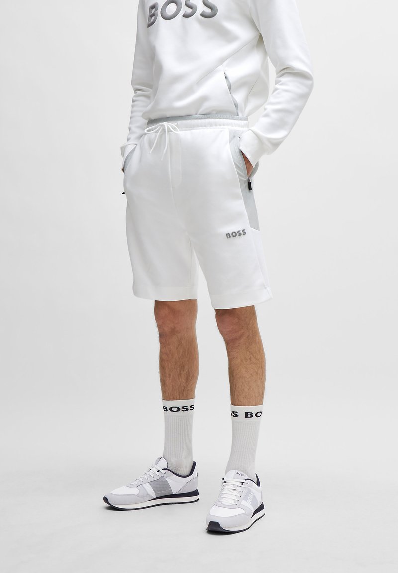 BOSS HEADLO - Spodnji deli trenirk - white