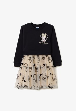 Zwarte lange mouwen jurk met een beige tule rok met zwart Minnie Mouse hoofdpatronen en een knipogende Minnie Mouse gezicht met strik op de borst.