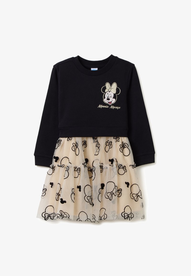 Schwarzes langärmliges Kleid mit einem beigen Tüllrock, der mit schwarzen Mustern von Minnie Maus Köpfen und einem zwinkernden Gesicht von Minnie Maus mit Schleife auf der Brust verziert ist.