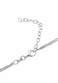 Silver chain bracelet featuring a lobster clasp, intricate links, and a double-strand design, showcasing a polished metal finish.
