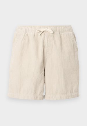 Beige kordbársony rövidnadrág, elasztikus derékkal és zsinórral, oldalsó zsebekkel és texturált, bordás mintázattal.
