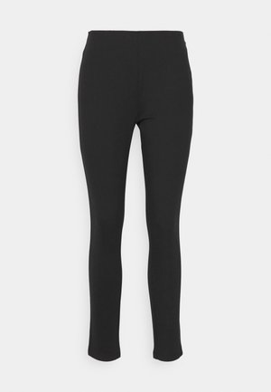 Sorte leggings laget av elastisk stoff med en glatt tekstur, med høy midje-design og slank, avsmalnende benform. Ingen synlige sømmer.