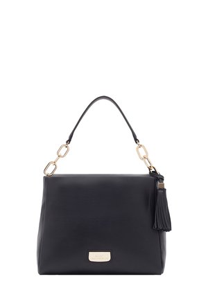 Black leather handbag with a structured shape, featuring a top handle, gold hardware, and a tassel detail on the side.