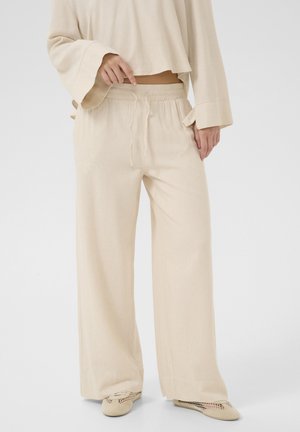 DIAS - Trousers - almond milk melange