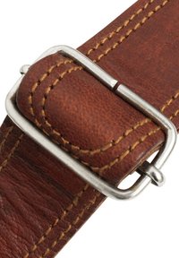 Brown leather strap with visible texture and stitching, featuring a silver-tone metal buckle with a prong closure.