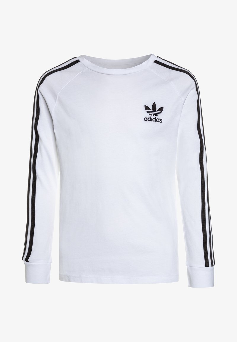 Camicia bianca a maniche lunghe con logo Adidas nero sul petto. Presenta strisce nere lungo le maniche e polsini a coste. Materiale morbido in cotone.