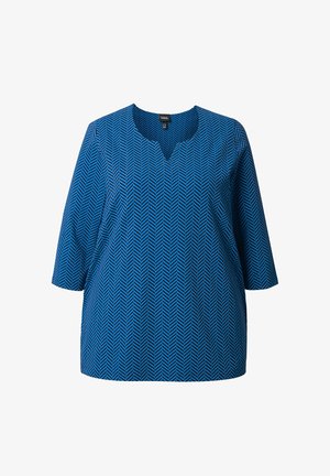 Blauwe tuniek met een visgraatpatroon, met een V-hals en driekwart mouwen. Gemaakt van een zachte, lichtgewicht stof.