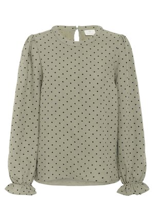 Blouse à manches longues vert olive avec des pois noirs, col rond, fermeture en goutte dans le dos et poignets froncés. Texture douce et coupe décontractée.