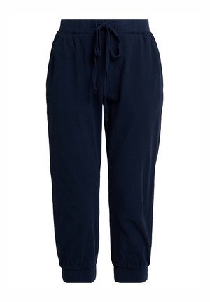 Pantalon de jogging bleu marine en tissu doux. Il est doté d'une ceinture élastique avec cordon de serrage et de chevilles resserrées pour une coupe décontractée.