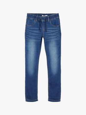 Modré denimové džiny s hladkou textúrou, elastickým pásom a úzkym strihom. Obsahujú predné vrecká a jemné blednutie pre opotrebovaný vzhľad.