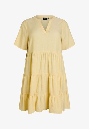 Light yellow, short-sleeve, tiered dress with V-neckline and loose fit, labeled Zizzi.
