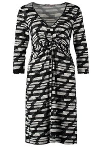 Robe noire et blanche longueur genou avec manches 3/4, col en V, détail froncé à l'avant et motif abstrait circulaire et rectangulaire.