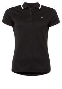 Černé polo tričko s bílým límečkem, třemi knoflíky a logem na levé straně hrudi. Krátké rukávy a zaoblený spodní lem.