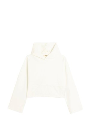 Haut cropped en tissu crème clair doux. Il présente un col haut, des manches longues et un design simple sans embellissements.