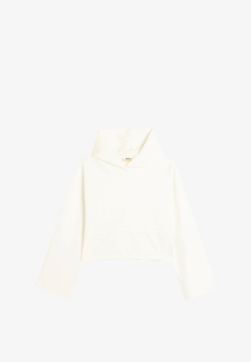 Przycięta bluza z kapturem z miękkiego, jasnobeżowego materiału. Posiada wysoki kołnierz, długie rękawy i prosty fason bez ozdób.