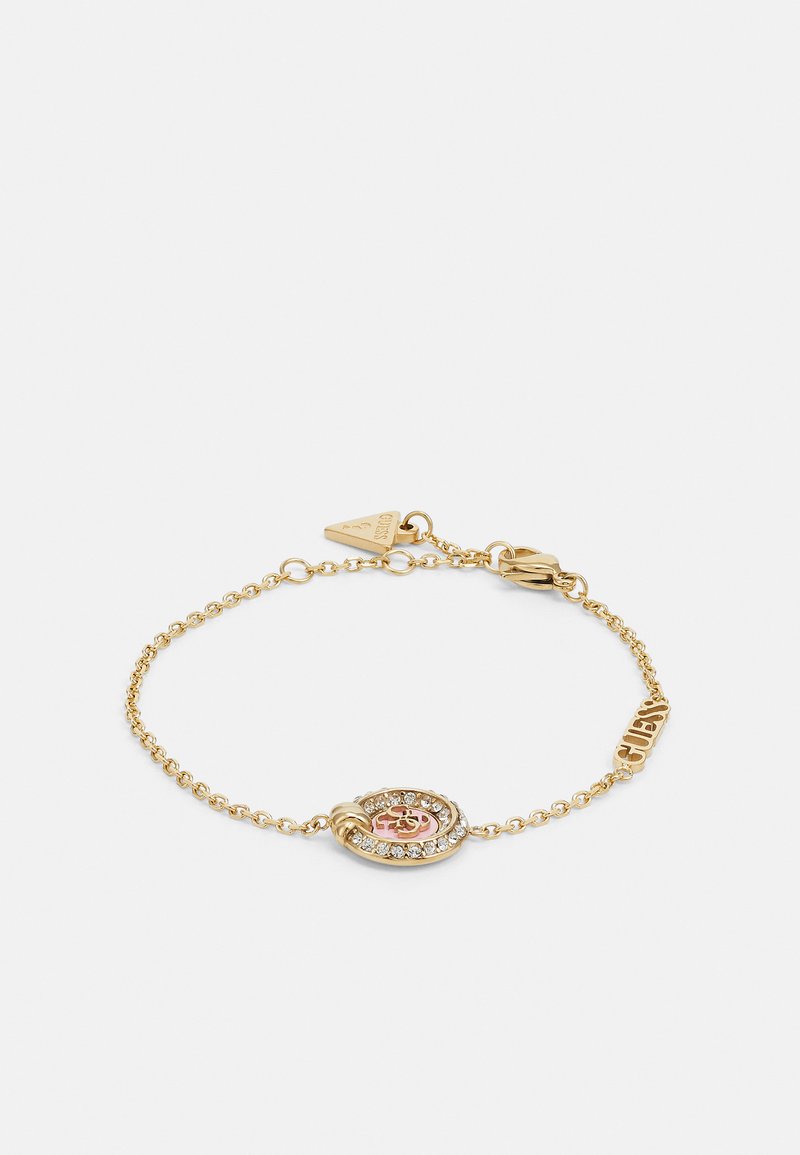Gold chain bracelet featuring a centerpiece with a pink and clear stone design, accented by a tag engraved with "Guess."