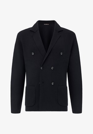 Blazer croisé marine en tissu texturé, avec des revers à cran, quatre boutons et deux poches avant.