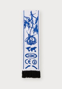 White scarf with blue floral design, featuring a fringed black edge and printed logos, symbols, and a world map pattern.