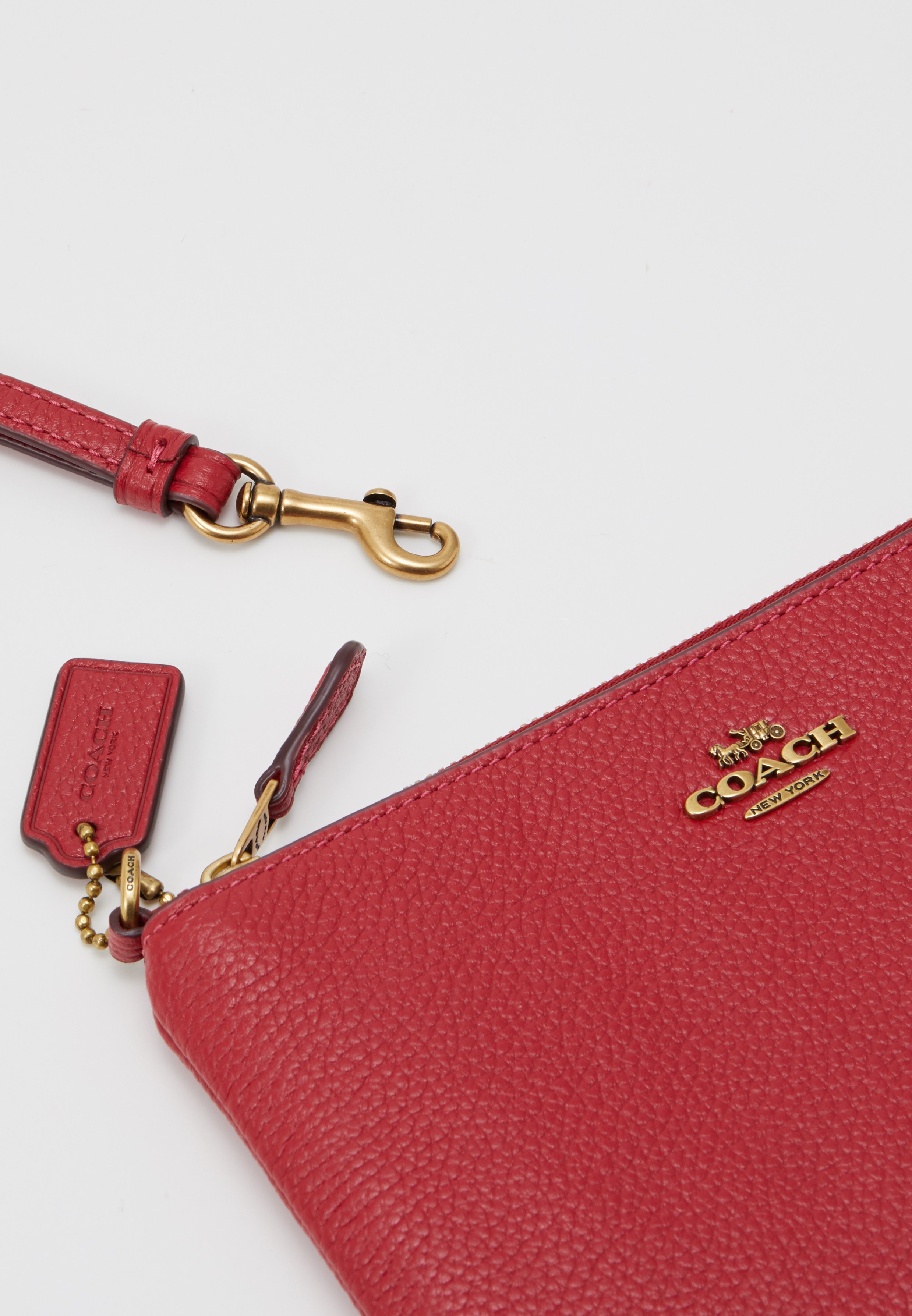 red leather wristlet