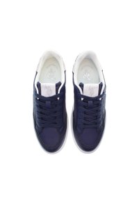 Navy blue sneakers with a smooth leather upper, white accents, round toe, flat laces, and a textured sole. Logo on the tongue and insole.