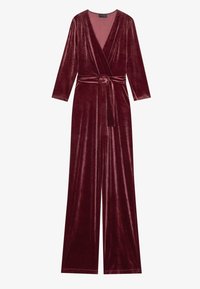 Burgunderfarget fløyels jumpsuit med lange ermer, dyp V-hals, omslagsdesign og matchende belte med sirkulær spenne, med vide bukser.