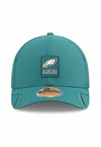 Teal baseball cap featuring a fitted design, front logo patch of an eagle, and curved brim. Includes adjustable sizing label underneath.